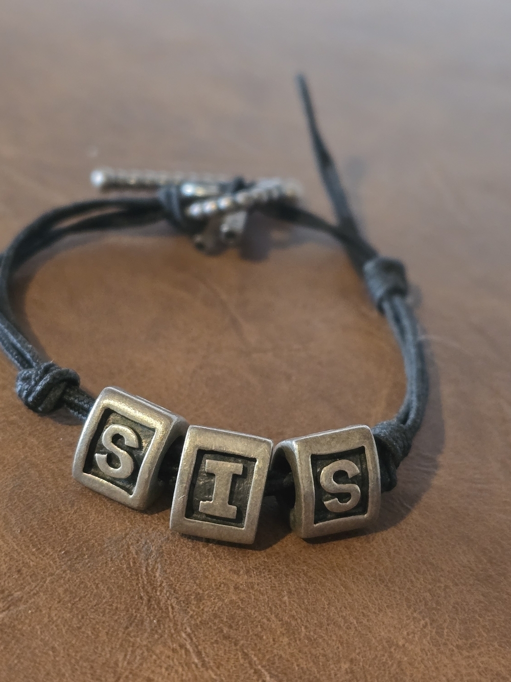 Pandora Black Cord Bracelet with Silver 'SIS' Letter Beads